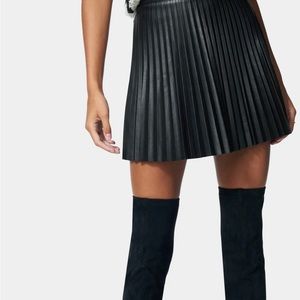 A black vegan leather Bebe skirt size 4